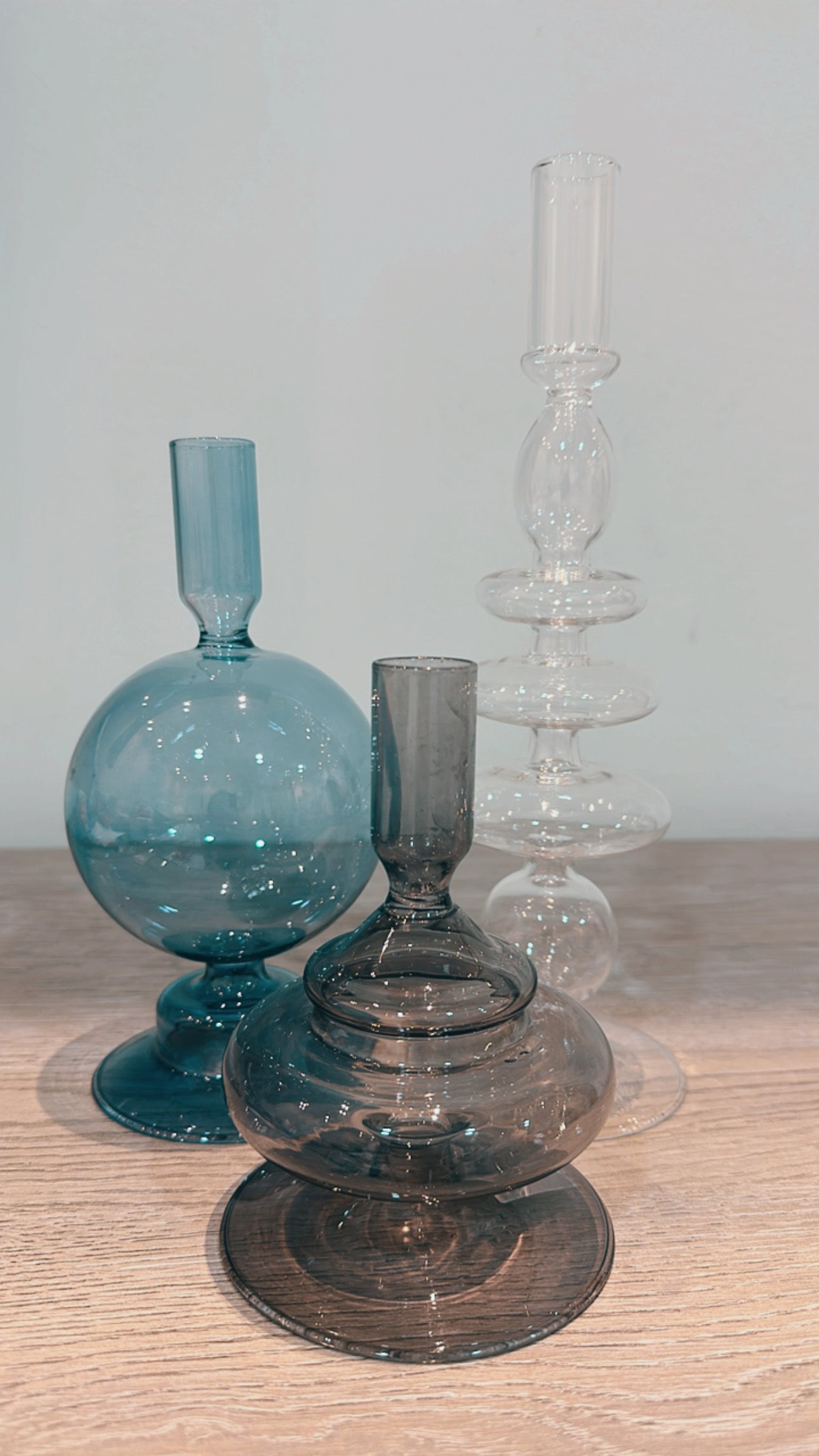 Set of three glass candle holders