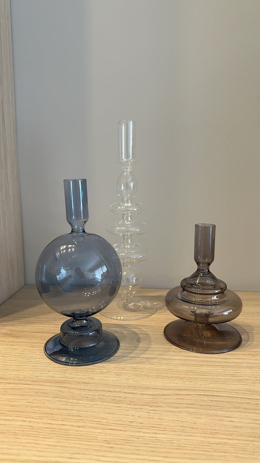 Set of three glass candle holders